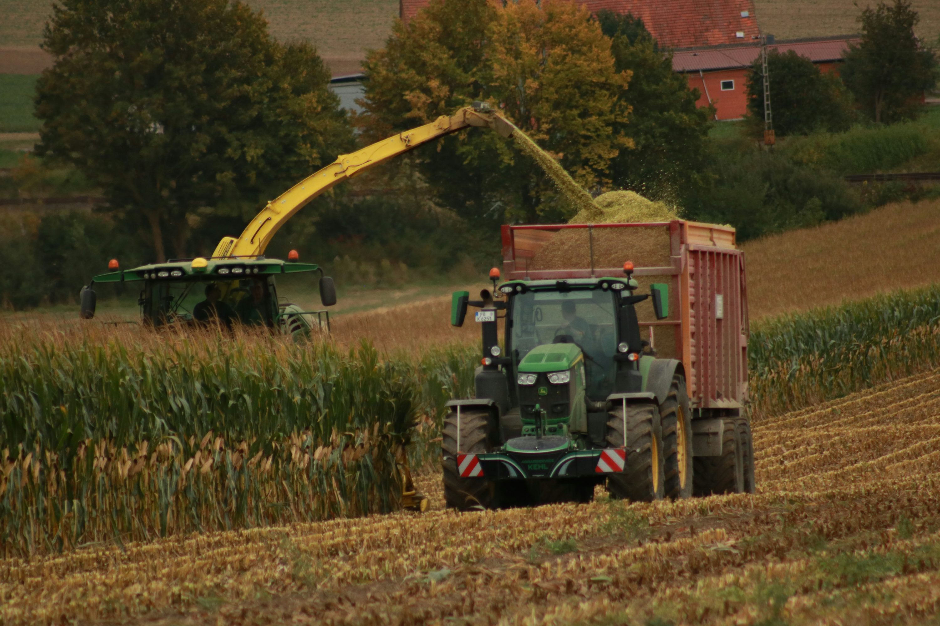 Tractor harvesting crops in an agricultural field