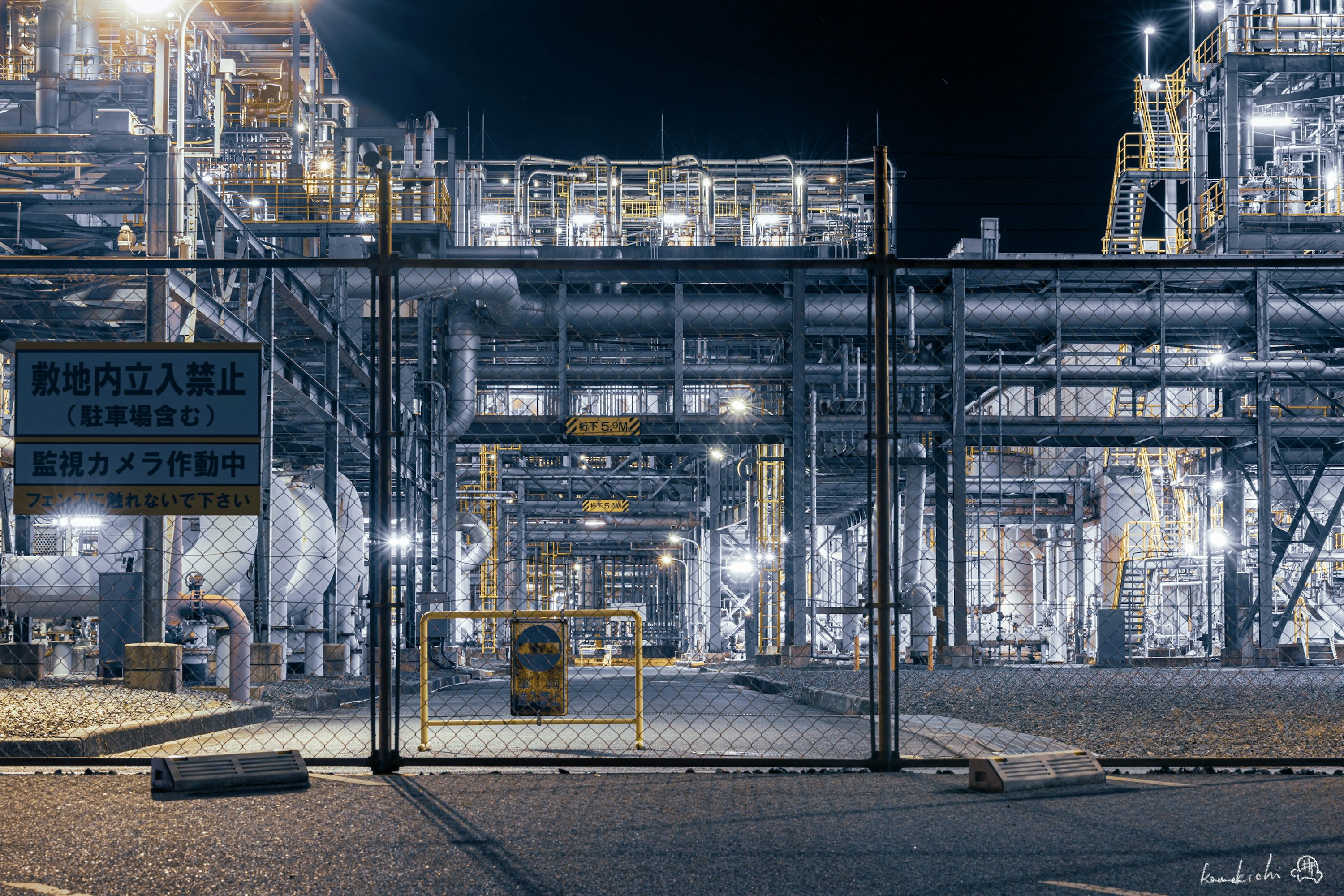 Oil refinery illuminated at night